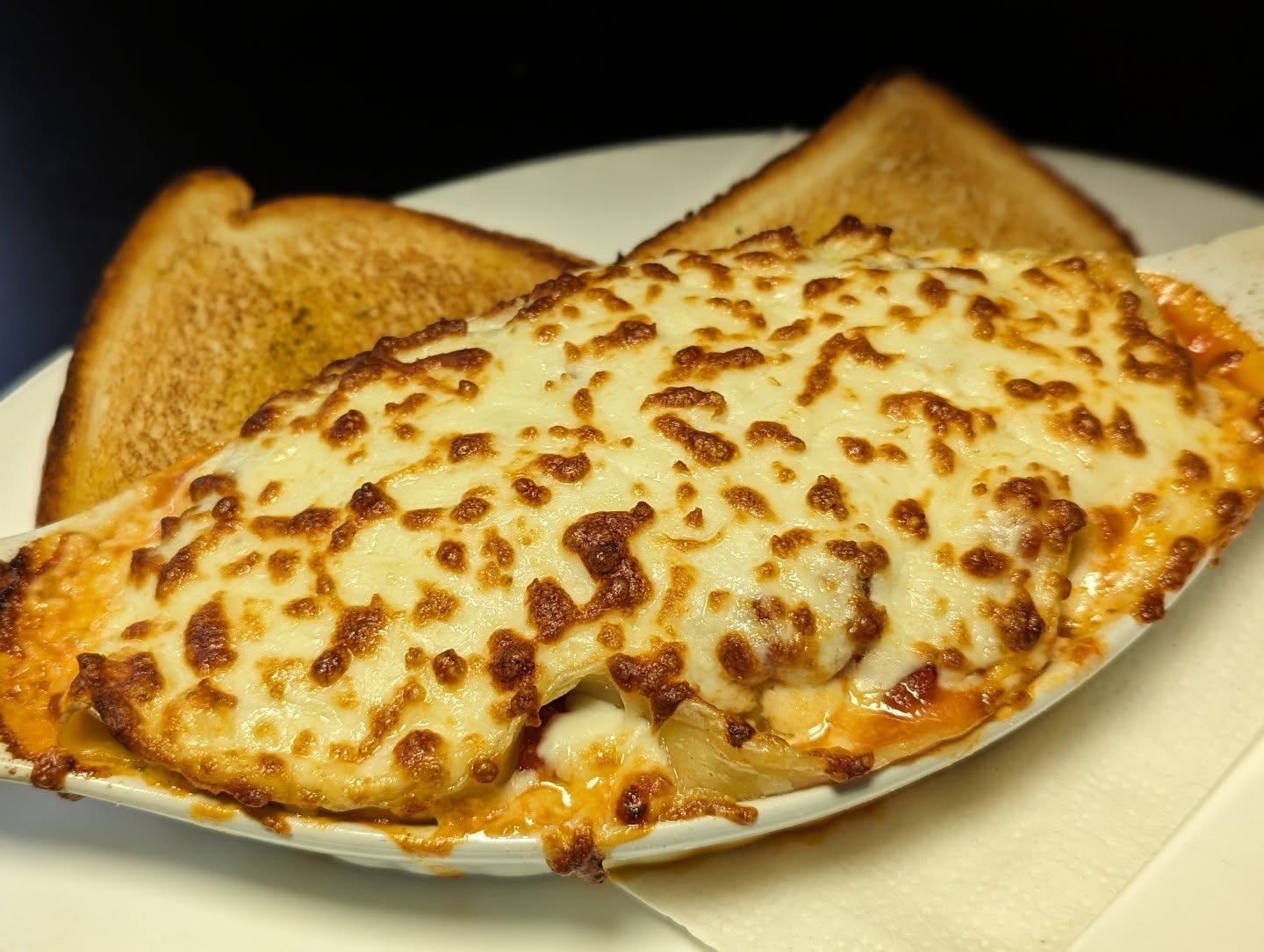 Specialty pizza with fresh toppings at Time Out Pub Edmonton